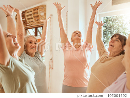 Fitness, success and senior women with their hands up in celebration after yoga or pilates training class. Smile, teamwork and happy elderly friends celebrate wellness goals or target in retirement 105001392