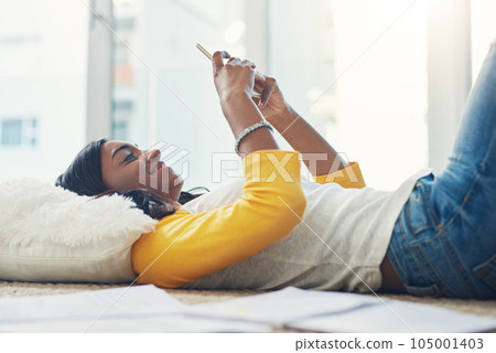 Home floor, cellphone and relax woman scroll, typing and texting social media user, gen z contact or person. Mobile smartphone connection, digital communication and female student using phone app 105001403
