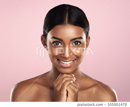 Face portrait, skincare and smile of woman in studio isolated on a pink background. Natural beauty, aesthetic and Indian female model with makeup, cosmetics and spa facial treatment for healthy skin. 105001478