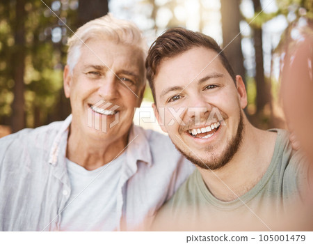 Happy man, selfie or senior father in woods or nature for family memory or bonding with smile, care or love. Portrait, photography or mature dad taking pictures together for social media with son 105001479