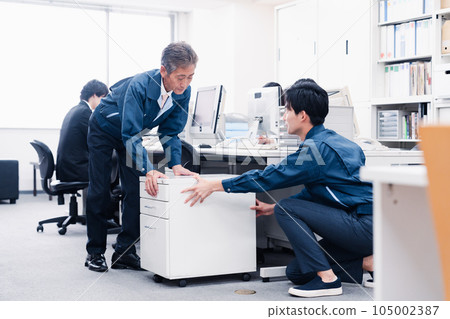 Work staff carrying office furniture Work staff carrying office furniture 105002387