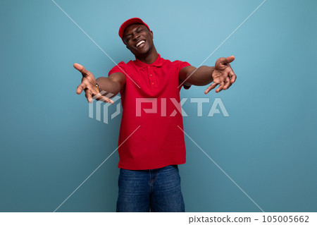 clothing for identity and branding. successful young handsome american man in red t-shirt and cap 105005662