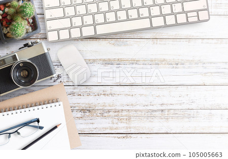 Wood office desk table with a lot of things on it. 105005663