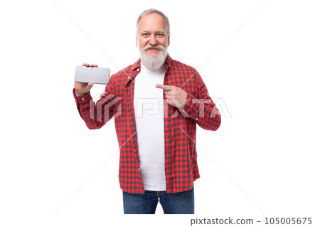 handsome 60s middle aged mature man in stylish shirt showing advertisement on smartphone 105005675