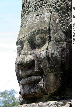 Sculpted Khmer face at Angkor Thom in Cambodia 105005818
