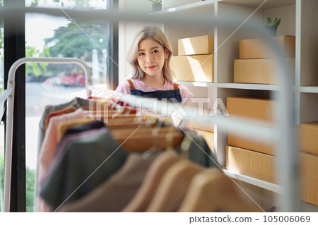 Small and medium business freelance worker working at home office. Startup and Online SME business concept Small and medium business freelance worker working at home office. Startup and Online SME business concept 105006069
