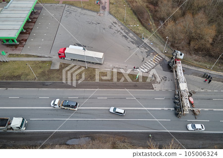 Aerial view of road accident with overturned truck blocking traffic Aerial view of road accident with overturned truck blocking traffic 105006324