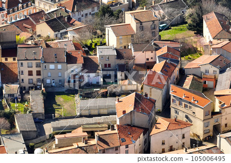 Aerial view of dense historic center of Thiers town in Puy-de-Dome department, Auvergne-Rhone-Alpes region in France. Rooftops of old buildings and narrow streets 105006495
