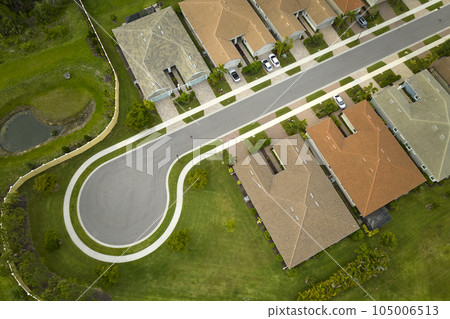 Aerial view of cul de sac at neighbourhood road dead end with densely built homes in Florida closed living area. Real estate development of family houses and infrastructure in american suburbs 105006513