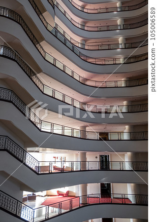Many floors in the hotel, view from inside. Many levels with stairs. Hotel Golden City in Alanya, Turkiye. ALANYA - June 2023. Balconies of floors inside Goldcity hotel, Five-star hotel Goldcity 105006589