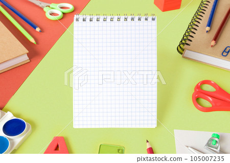 Colorful school supplies on light green background. Blank paper sheet. Stationery Items flat lay. Back to school concept. College tools props accessories. Lime Nouveau trendy color. Top view 105007235