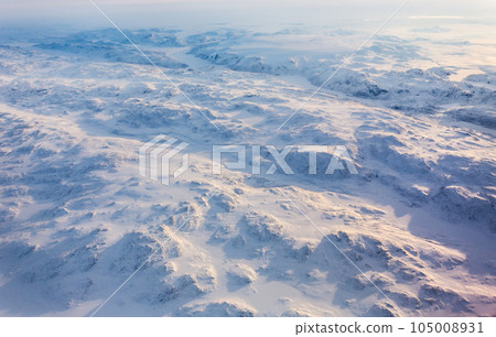 Greenlandic ice cap with frozen mountains and fjords aerial view, near Nuuk, Greenland 105008931