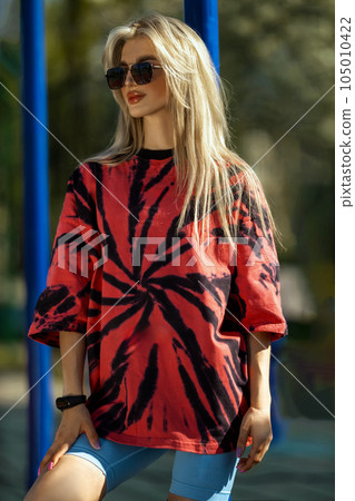 blonde athletic girl stands on the sports ground blonde athletic girl stands on the sports ground 105010422