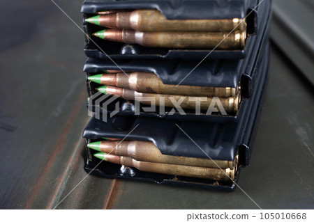 5.56*45mm cartridges with standard lead core bullets with steel penetrator loaded in magazines 105010668