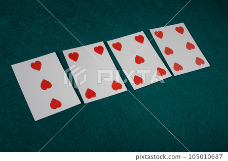 Old west era playing card on gambling table. 105010687