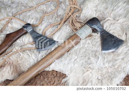 Viking battle axes on sheep fur Viking battle axes on sheep fur 105010702