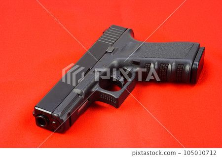 semiauto handgun on red background semiauto handgun on red background 105010712