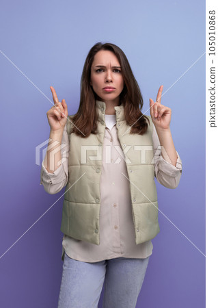 emotional black-haired young lady in casual clothes reports an idea that has arisen in her head on emotional black-haired young lady in casual clothes reports an idea that has arisen in her head on 105010868