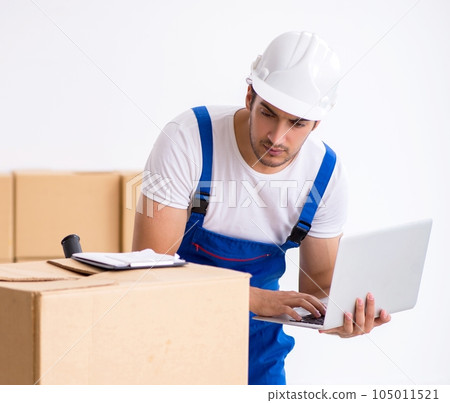 Young male professional mover doing home relocation 105011521