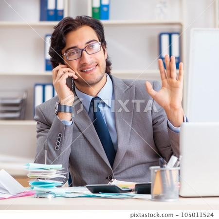 Young handsome businessman in budget planning concept 105011524