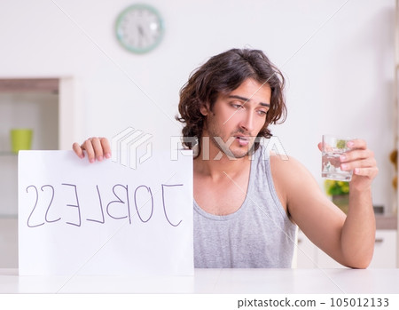 Unemployed man desperate at home Unemployed man desperate at home 105012133