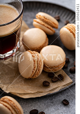 Coffee or chocolate macarons on a tray 105012411
