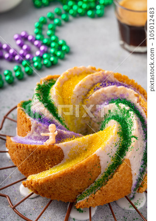 King cake with traditional decoration King cake with traditional decoration 105012483