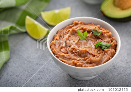 Refried beans in a white bowl Refried beans in a white bowl 105012553