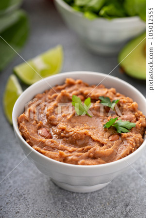 Refried beans in a white bowl Refried beans in a white bowl 105012555