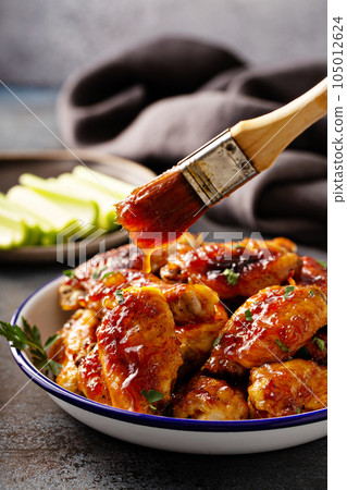 Sweet and spicy chicken wings with glaze 105012624