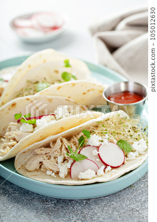 Healthy tacos with shredded chicken 105012630