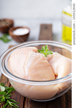 Chicken breast raw in a bowl 105012640