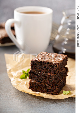 Stack of moist fudgy brownies 105012670