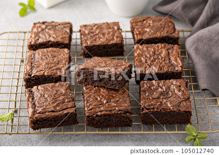 Homemade fudgy brownies on a baking rack Homemade fudgy brownies on a baking rack 105012740