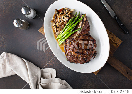 Beef steak with mushrooms and asparagus 105012746