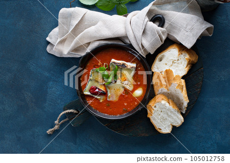 Baked cheese and garlic in tomato sauce Baked cheese and garlic in tomato sauce 105012758