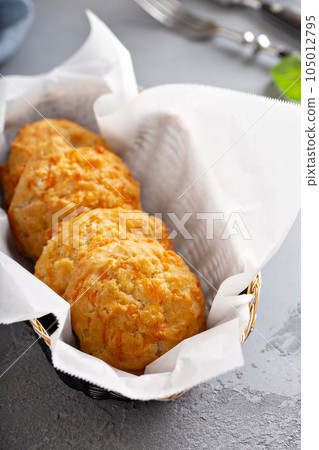 Cheese biscuits in a basket Cheese biscuits in a basket 105012795