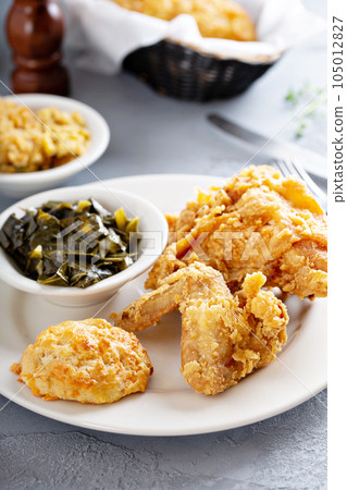 Southern fried chicken with collard greens Southern fried chicken with collard greens 105012827