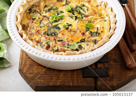 Homemade quiche with bacon and spinach Homemade quiche with bacon and spinach 105013137