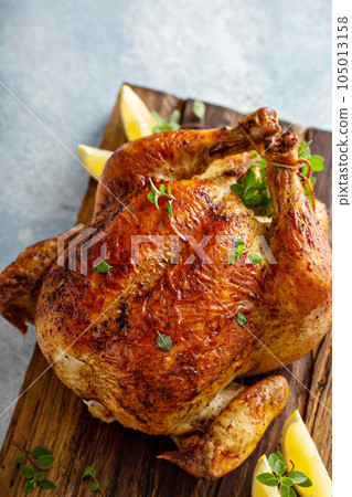 Roasted chicken with lemon and herbs Roasted chicken with lemon and herbs 105013158