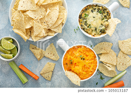 Artichoke spinach and buffalo chicken dips with chips 105013187