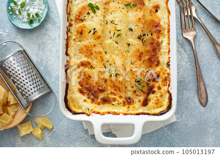 Cheesy scalloped potatoes Cheesy scalloped potatoes 105013197
