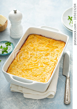 Cheesy cornbread freshly baked in a pan 105013204