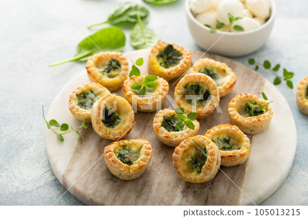 Spinach mini quiches freshly baked Spinach mini quiches freshly baked 105013215