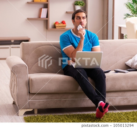 Sport bet addicted young man betting at home 105013294