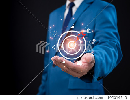 Businessman pointing to the target. Business concept. management concept business planning concept Businessman pointing to the target. Business concept. management concept business planning concept 105014543