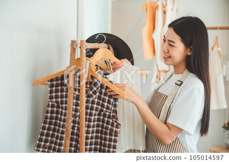 Small business owners are organizing and arranging a small store to welcome customers and get customers online. And check the orders that customers have ordered of online retailers - online shopping. 105014597