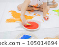 child playing with paint 105014694