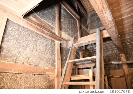 Steep stairs leading to the second floor of an old storehouse Steep stairs leading to the second floor of an old storehouse 105017678