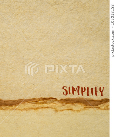 simplify reminder, pragmatic, declutter or get organized concept, inspirational handwriting on a handmade paper 105018158
